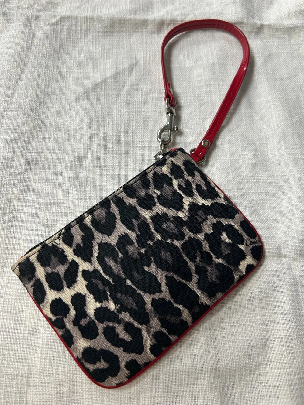 Coach wristlet featuring